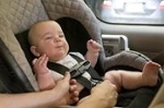 Baby in a carseat.