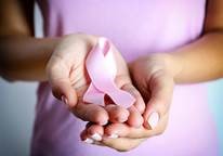 Hands Holding a Pink Ribbon